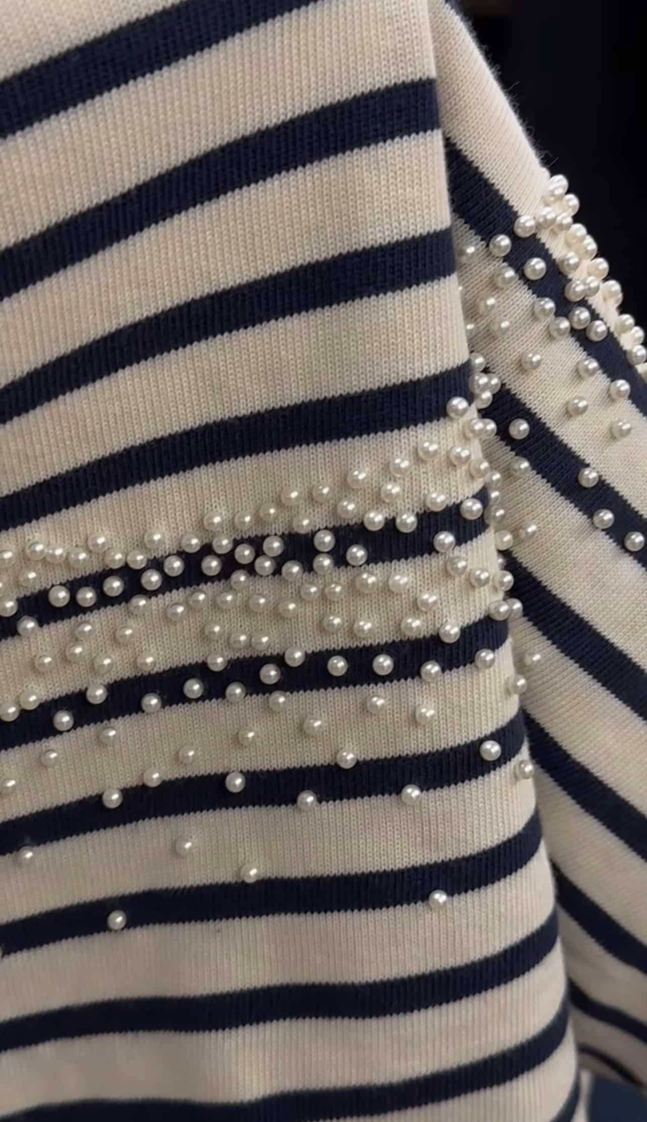 Navy and white striped fabric with clusters of small pearls.
