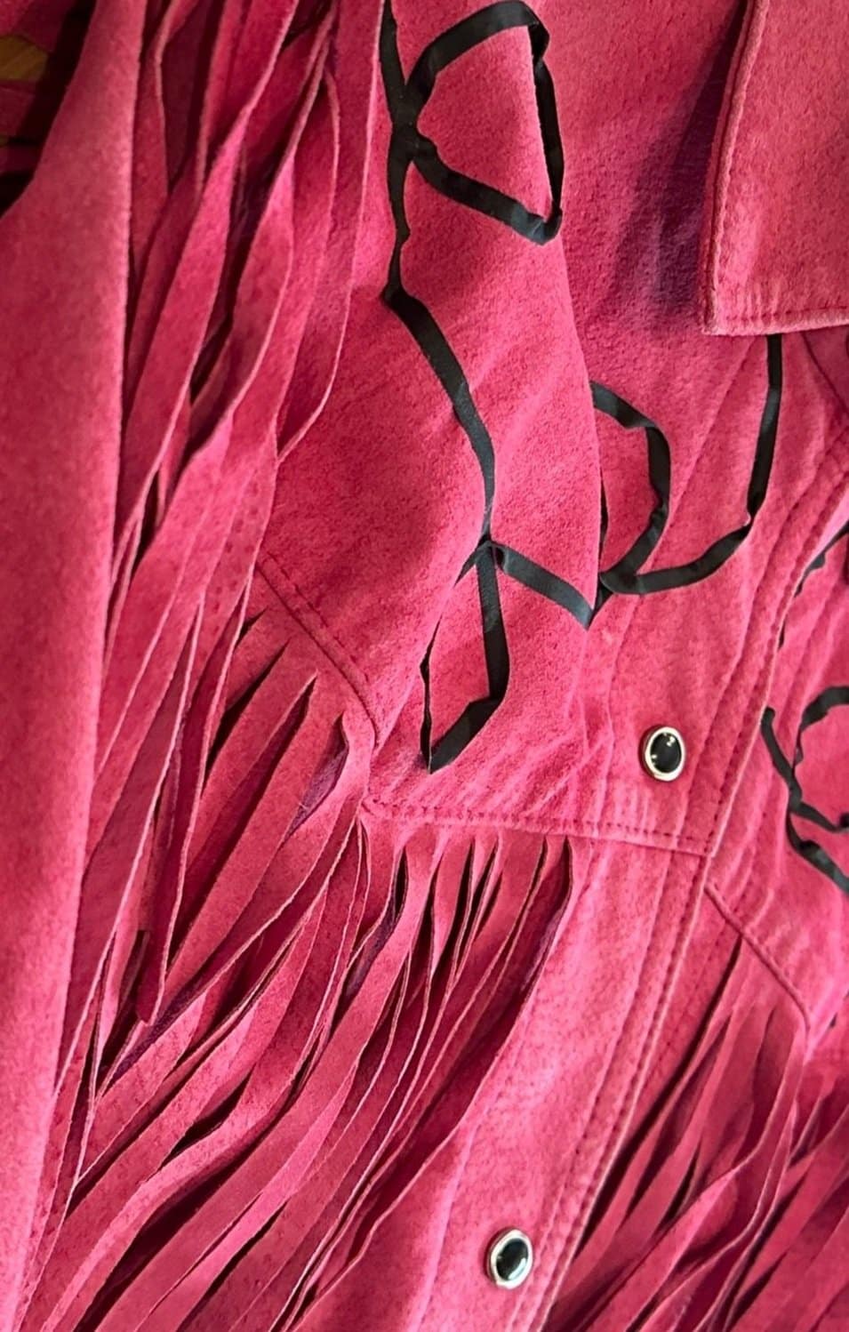 Delicate white embroidery on sheer tulle, featuring a floral and leafy pattern.